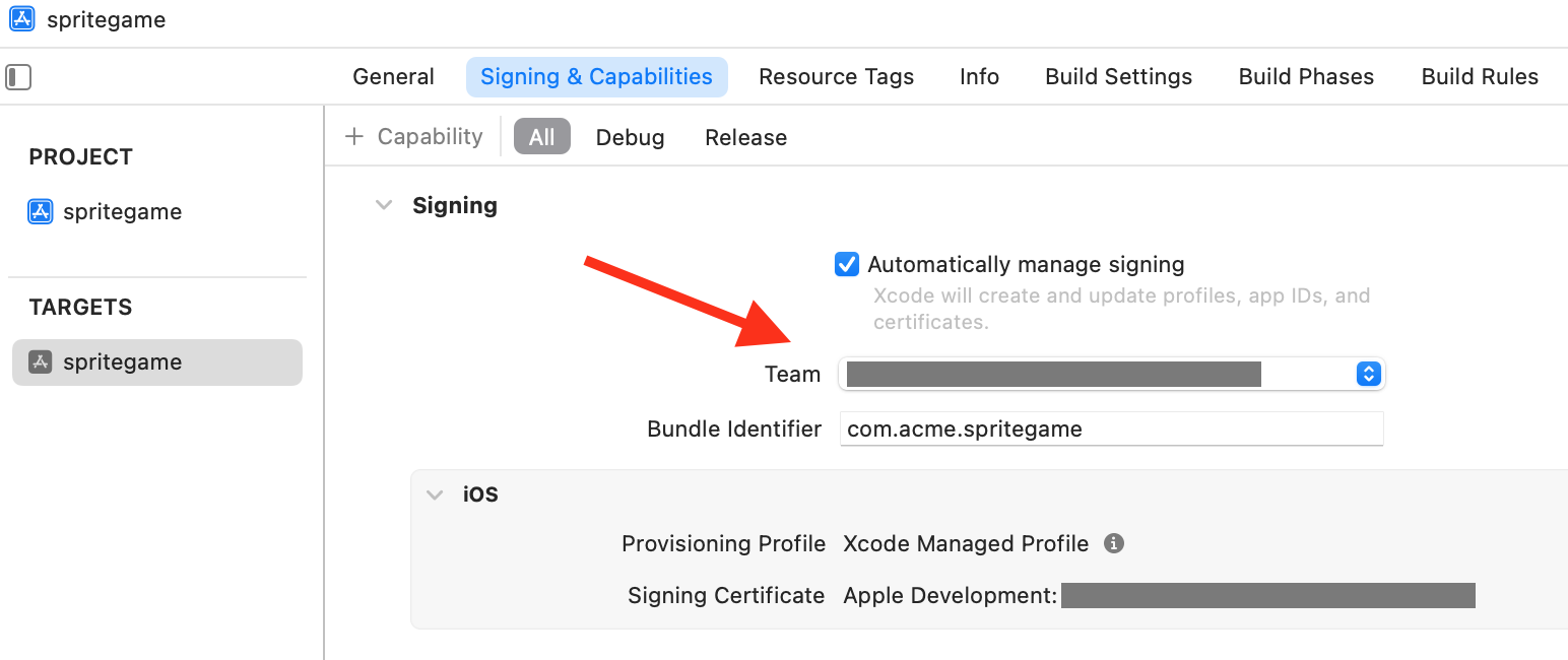 Xcode Signing & Capabilities editor with an arrow pointing at the selected team